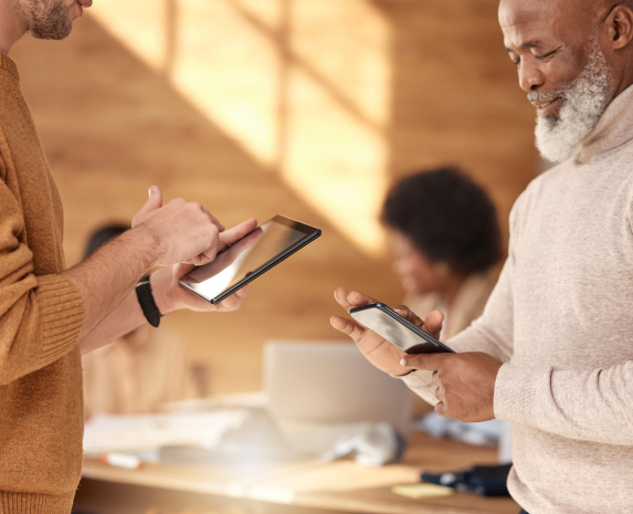 An occupational therapist with a payment ipad